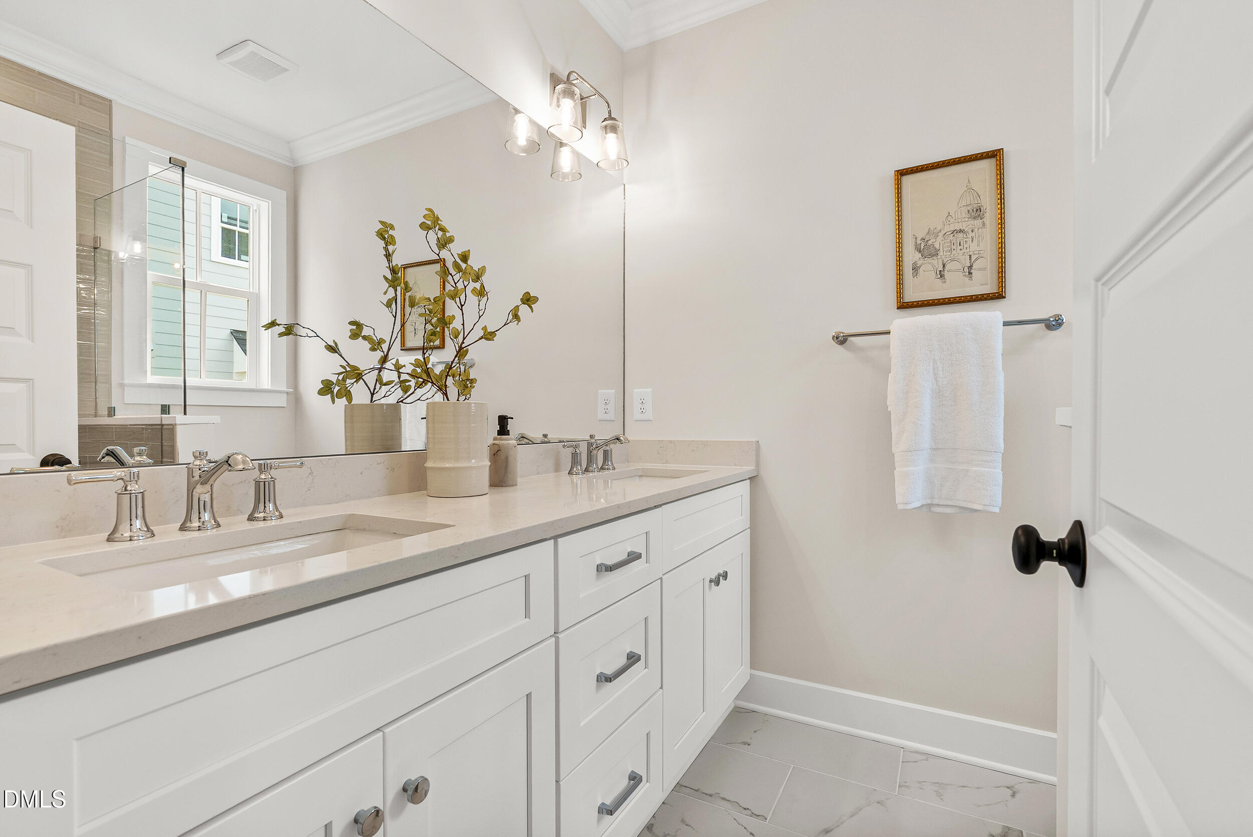 404 Chamberlin Avenue, Unit B Durham, NC 27704 - Photo 16 of 31 a bathroom with a double vanity sink and a mirror