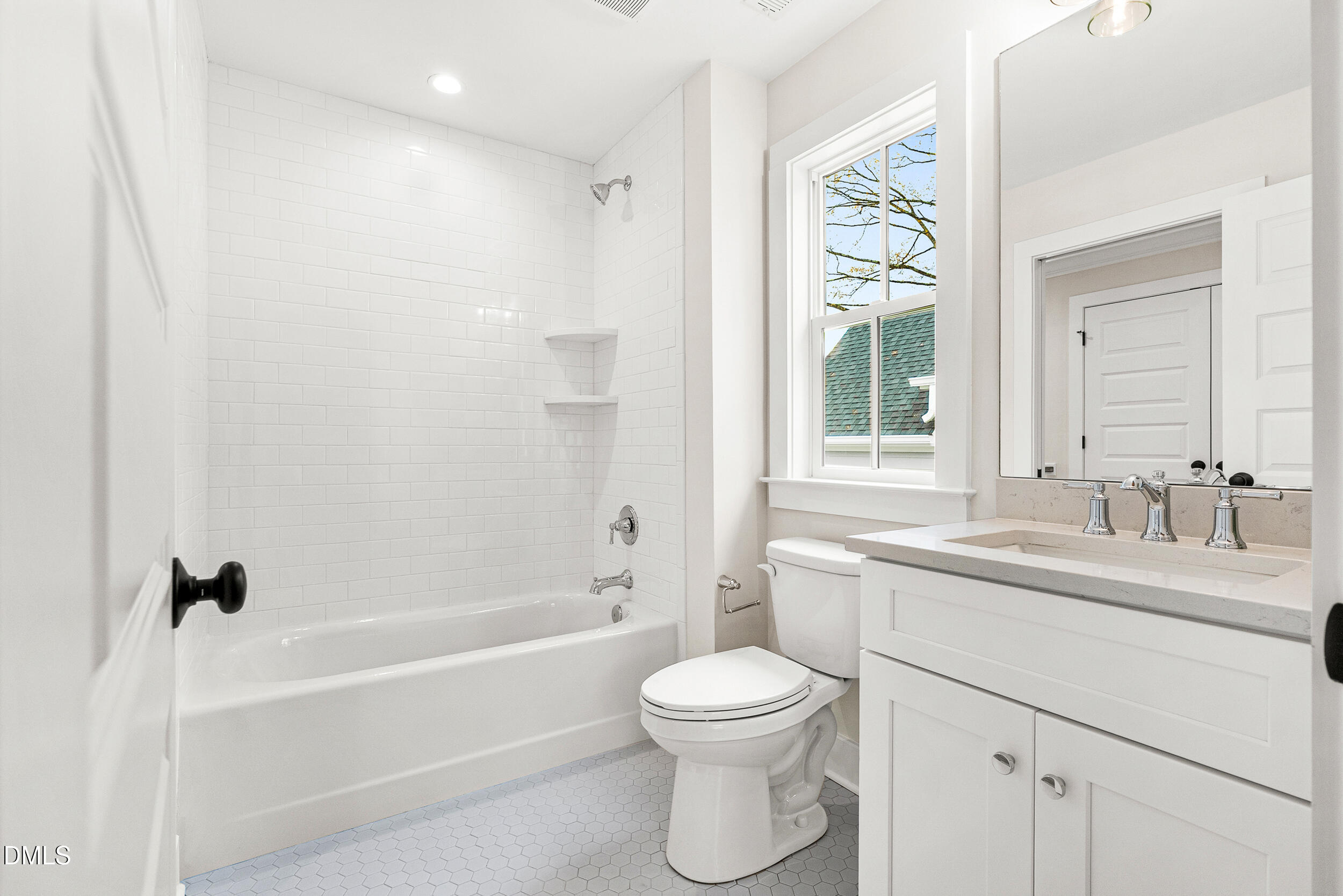 404 Chamberlin Avenue, Unit B Durham, NC 27704 - Photo 22 of 31 a bathroom with a sink a toilet and a bathtub