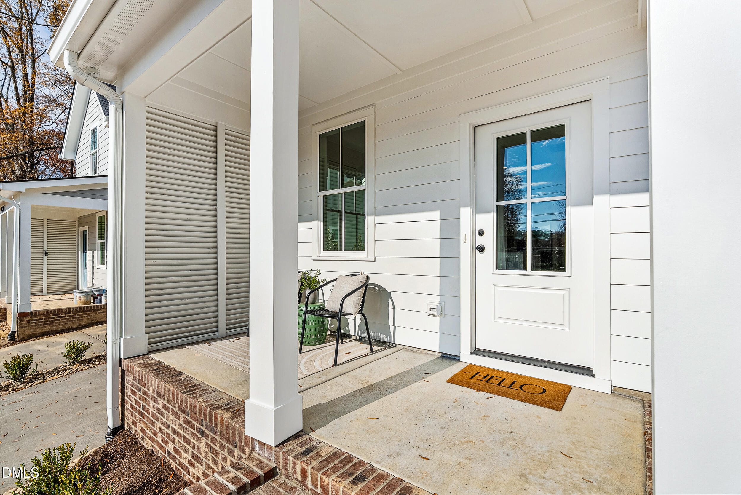 404 Chamberlin Avenue, Unit B Durham, NC 27704 - Photo 3 of 31 a view of a balcony with chairs and a potted plant