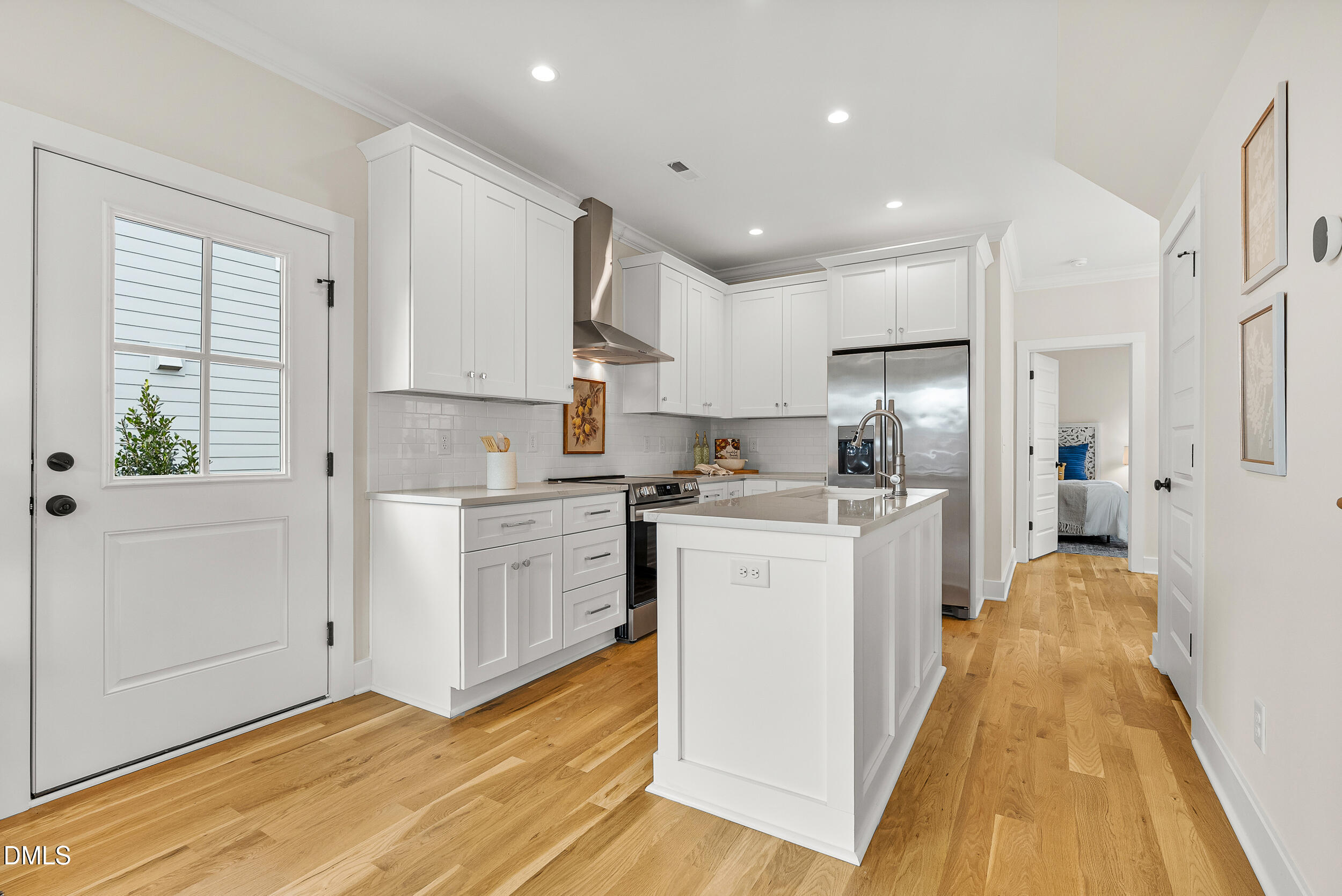 404 Chamberlin Avenue, Unit B Durham, NC 27704 - Photo 6 of 31 a kitchen with white cabinets and white appliances
