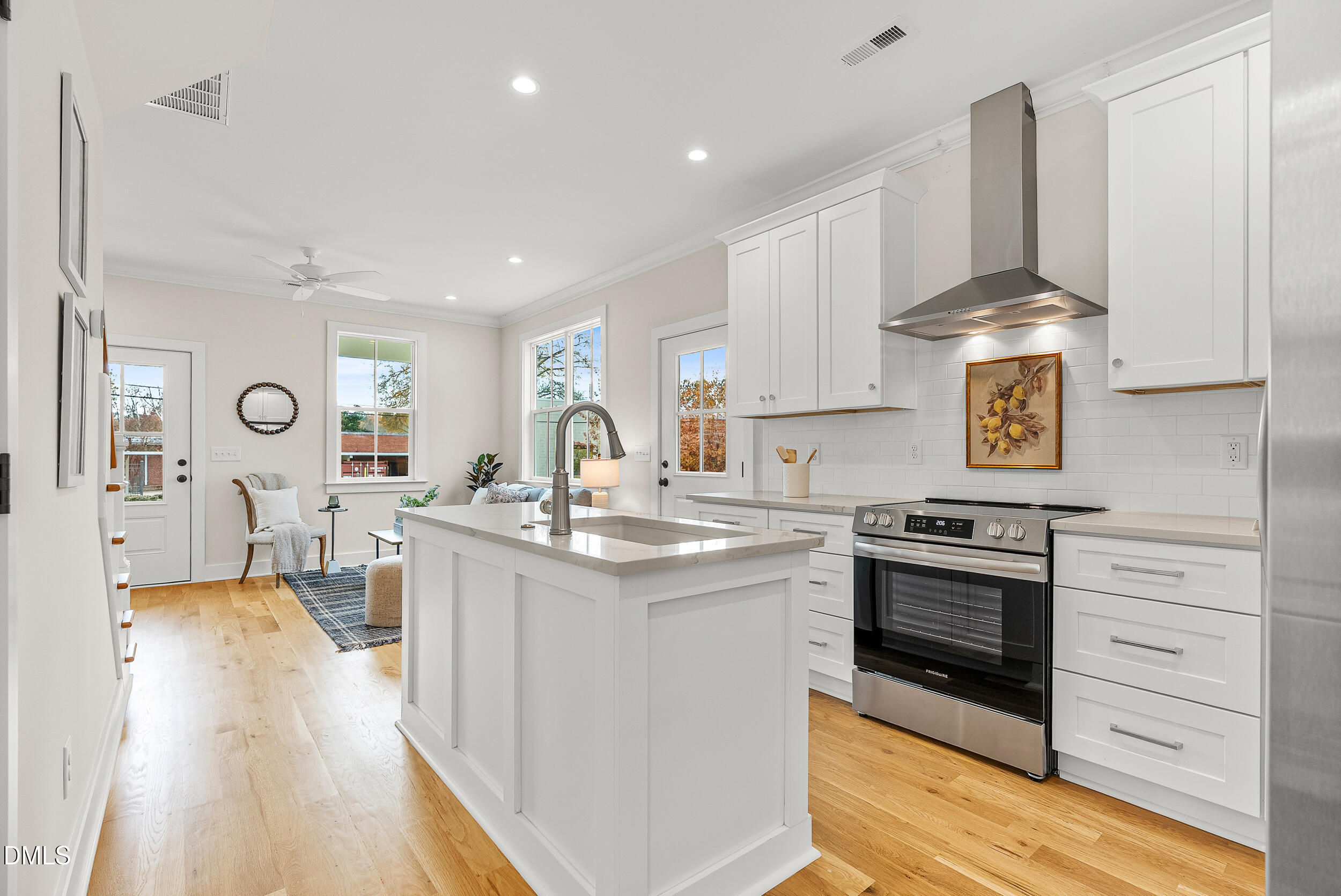 404 Chamberlin Avenue, Unit B Durham, NC 27704 - Photo 7 of 31 a kitchen with stainless steel appliances granite countertop a stove and a sink