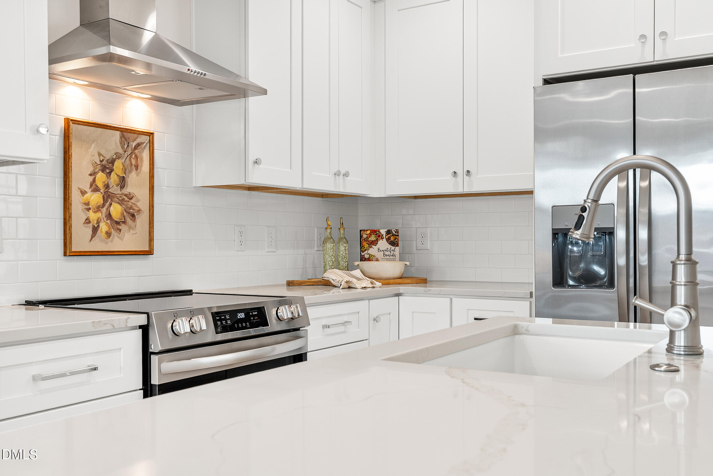 404 Chamberlin Avenue, Unit B Durham, NC 27704 - Photo 10 of 31 a kitchen with granite countertop white cabinets and white appliances