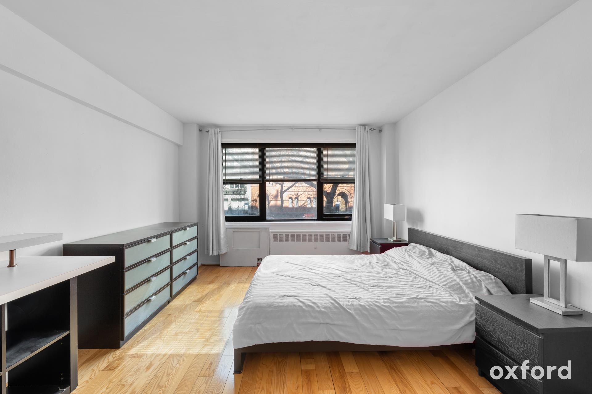 Undisclosed Address Manhattan, NY 10019 - Photo 3 of 20 a bedroom with a bed and window