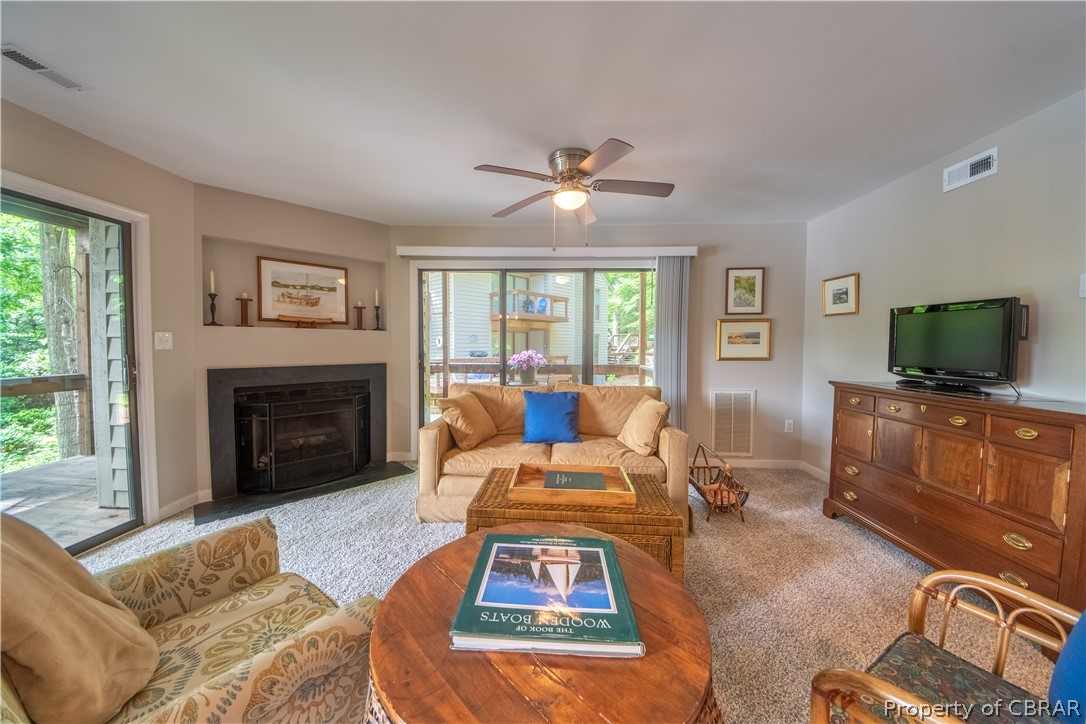 68 Villa Ridge Drive, Unit 4 Hartfield, VA 23071 - Photo 2 of 30 This great area has glass surrounding and doors to wrap arround deck.