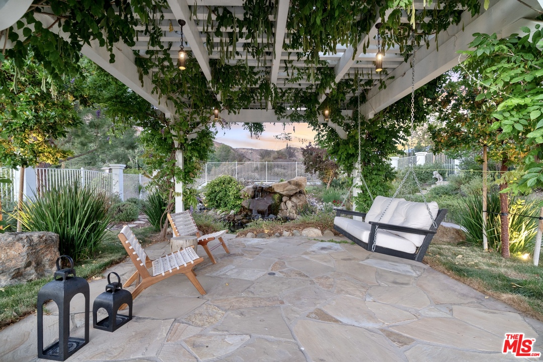 28845 Medea Mesa Road Agoura Hills, CA 91301 - Photo 4 of 12 a view of a bench in a backyard