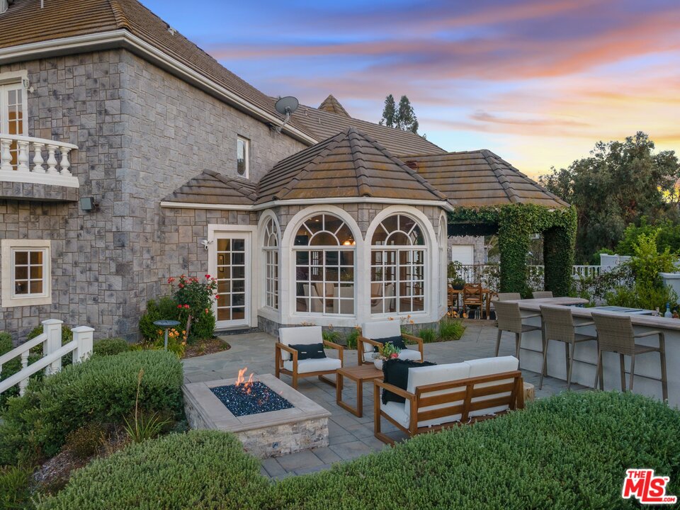 28845 Medea Mesa Road Agoura Hills, CA 91301 - Photo 5 of 12 a front view of a house with garden