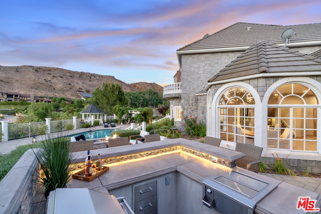 28845 Medea Mesa Road Agoura Hills, CA 91301 - Photo 6 of 12 a view of a house with pool and chairs