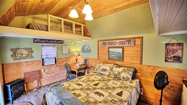 a very nice looking room with a chair and a window