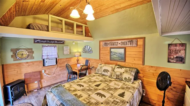 a very nice looking room with a chair and a window