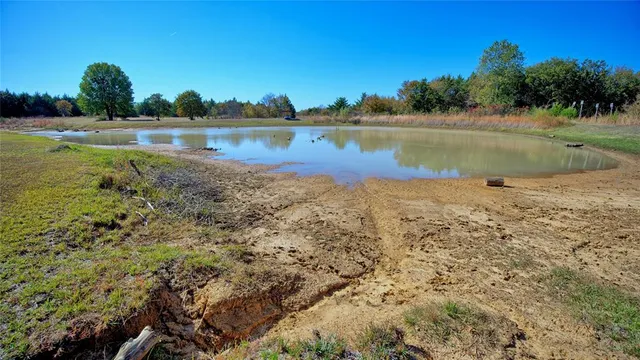 a view of a swimming pool and mountains in the background