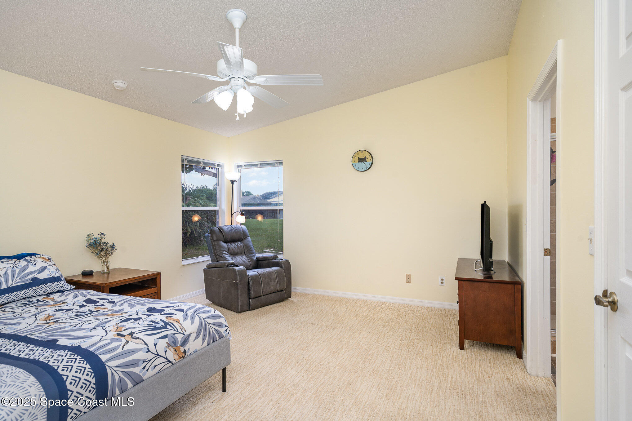 3623 Egret Drive Melbourne, FL 32901 - Photo 11 of 25 a bedroom with a bed and gym equipment