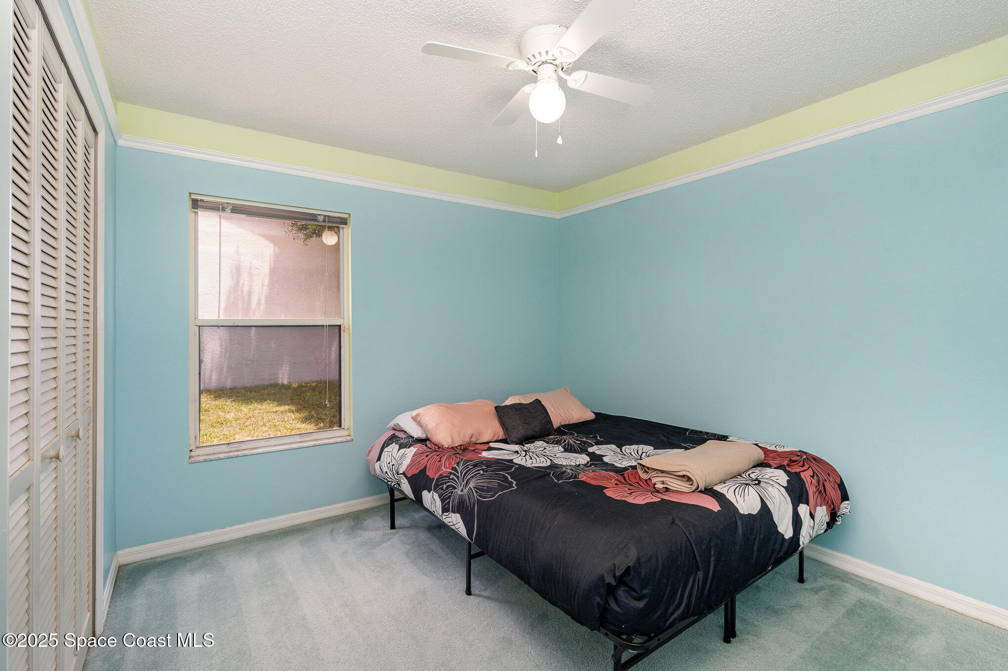 3623 Egret Drive Melbourne, FL 32901 - Photo 16 of 25 a bedroom with a bed and a window