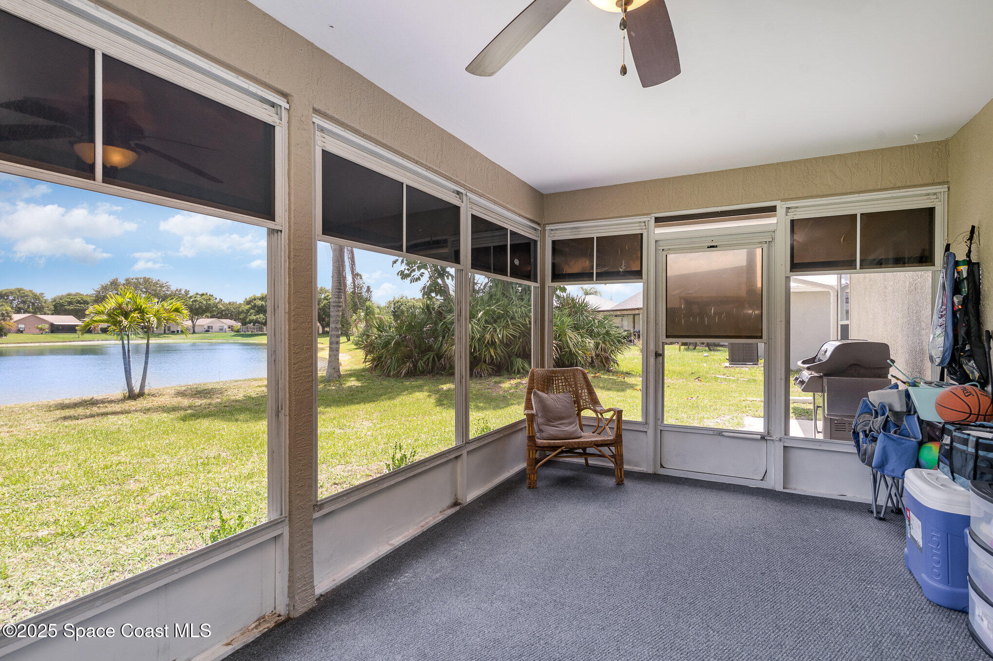 3623 Egret Drive Melbourne, FL 32901 - Photo 23 of 25 a view of living room with furniture and floor to ceiling window