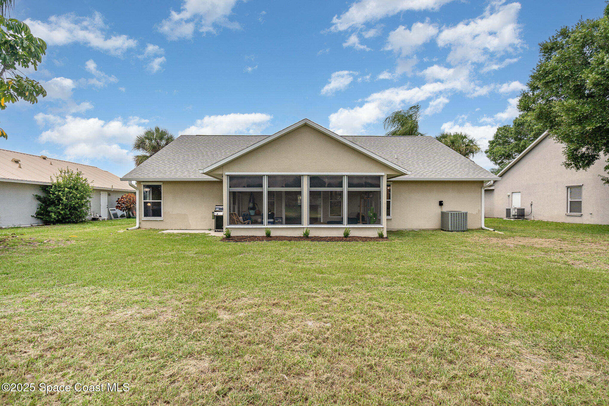 3623 Egret Drive Melbourne, FL 32901 - Photo 24 of 25 a front view of a house with a garden