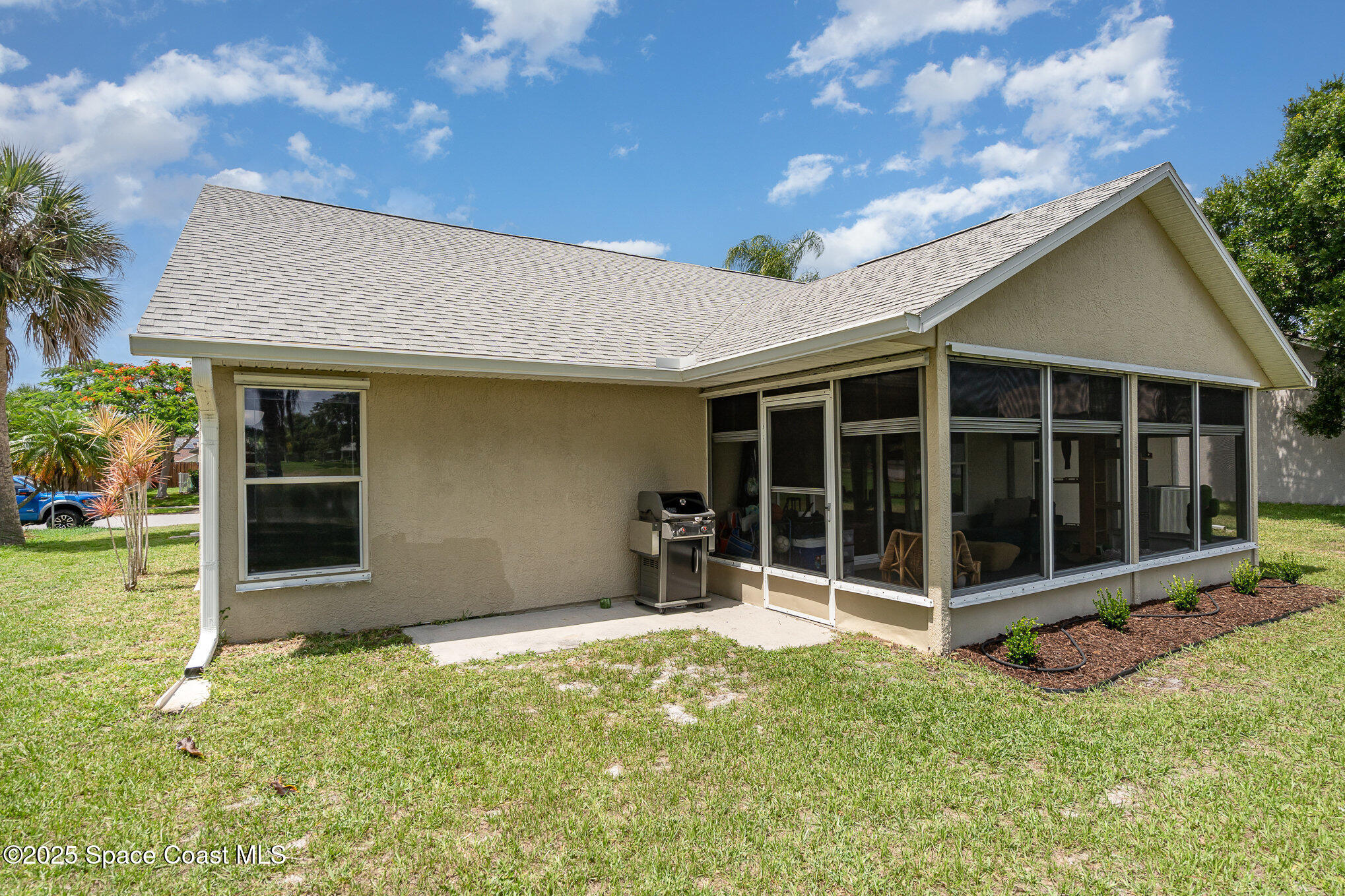 3623 Egret Drive Melbourne, FL 32901 - Photo 25 of 25 a view of a house with a large window and plants