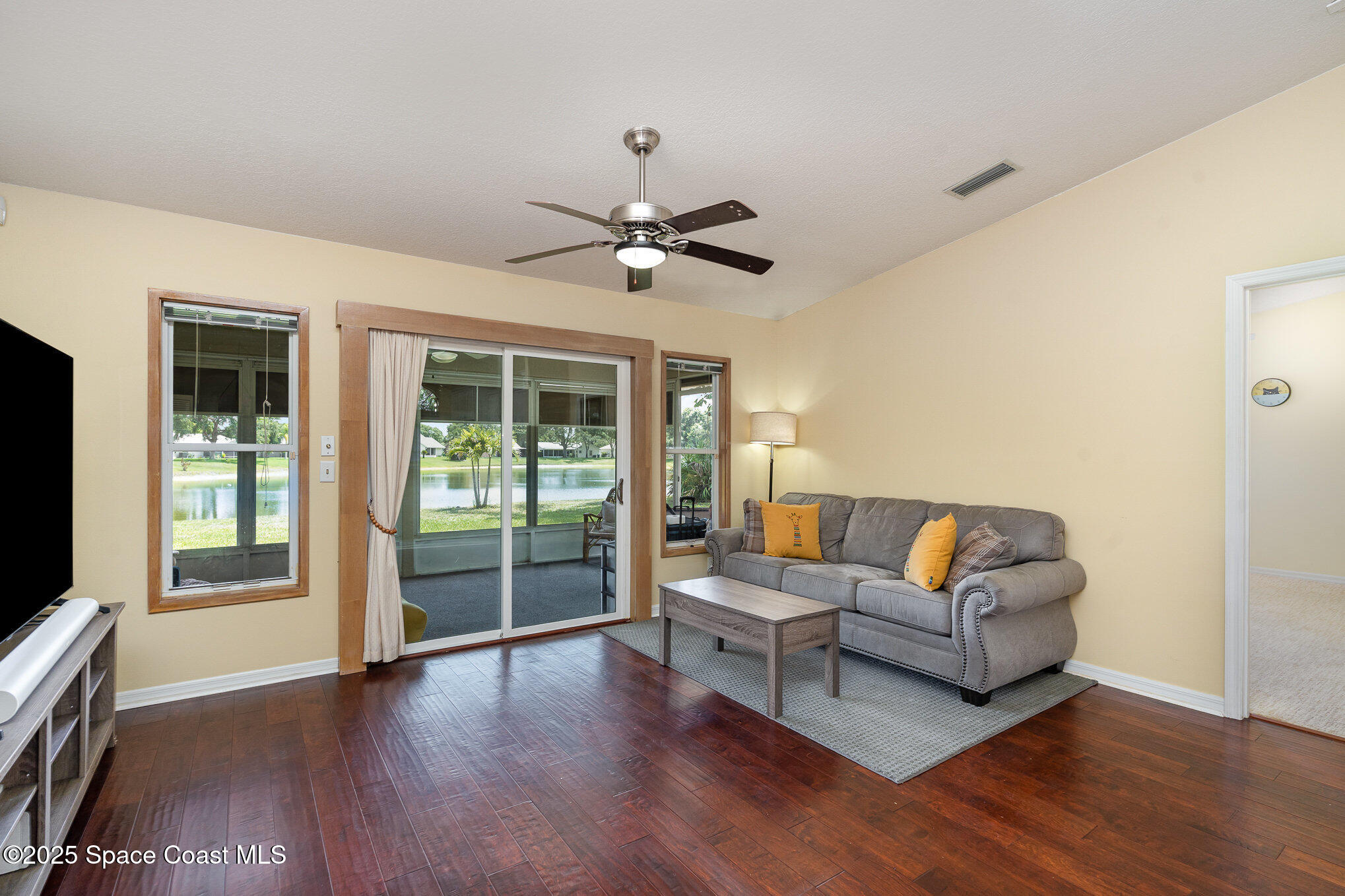 3623 Egret Drive Melbourne, FL 32901 - Photo 5 of 25 a living room with furniture and a large window