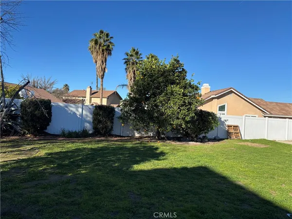 a view of a house with a yard and garage