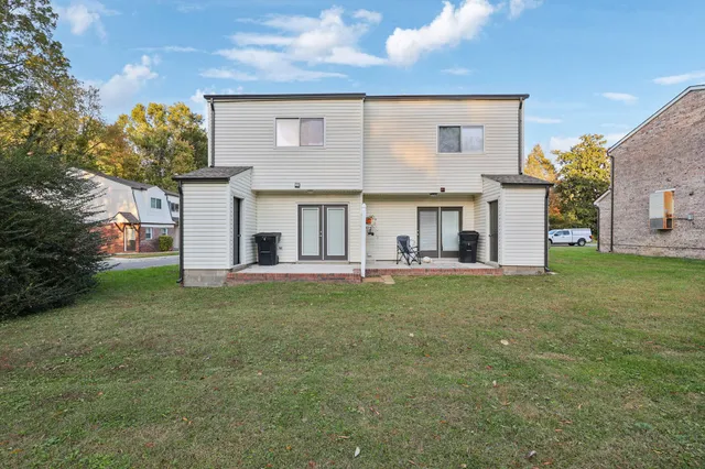 a view of a house with a backyard