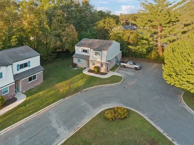 an aerial view of a house with a garden
