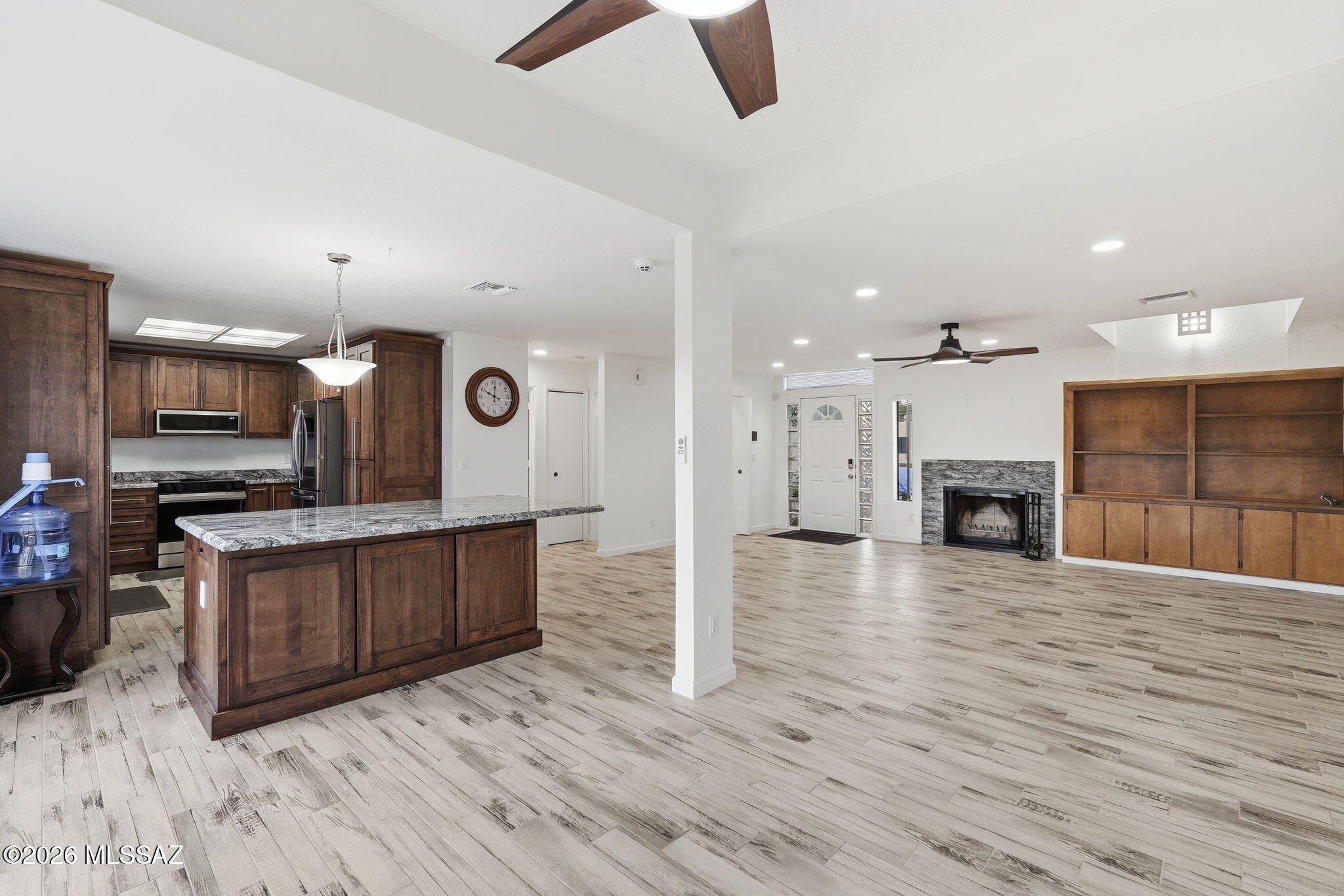 1183 Circulo Canario Rio Rico, AZ 85648 - Photo 5 of 31 a large kitchen with stainless steel appliances kitchen island granite countertop a large island in the center