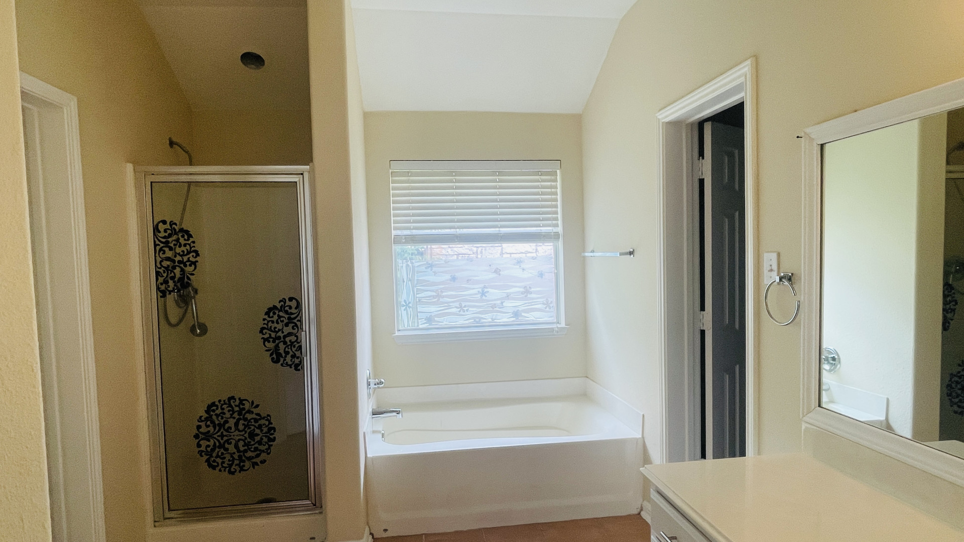 6805 Cromarty Lane Austin, TX 78754 - Photo 12 of 18 a bathroom with a bathtub and a shower