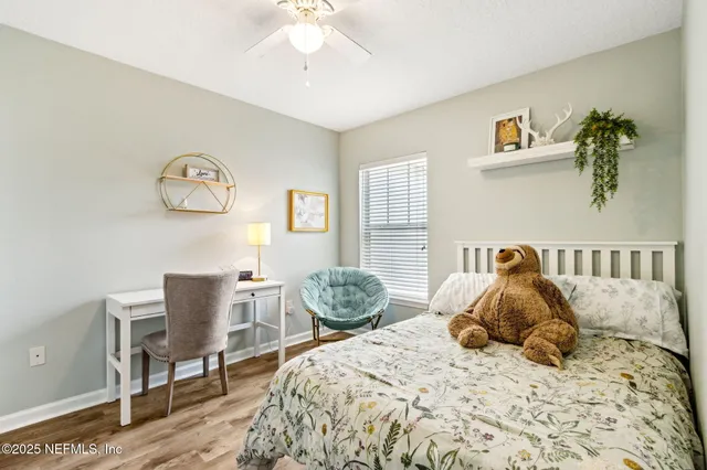 a bedroom with a bed and a table