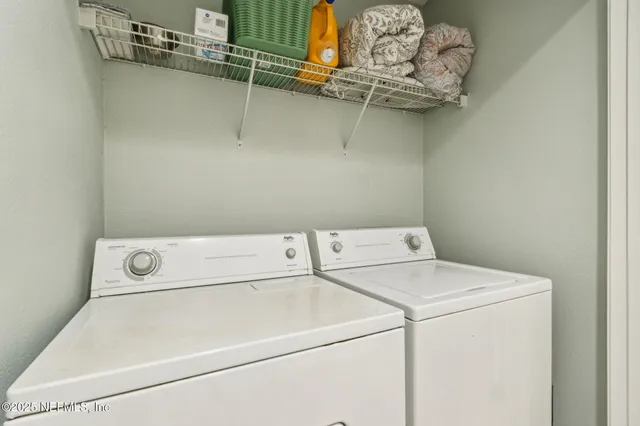 a utility room with dryer and washer