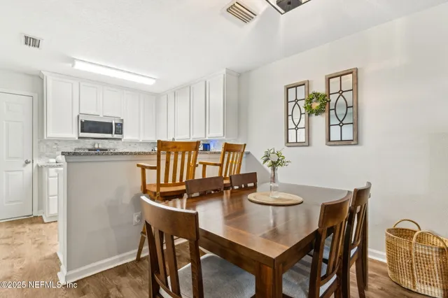 a view of a dining room with furniture
