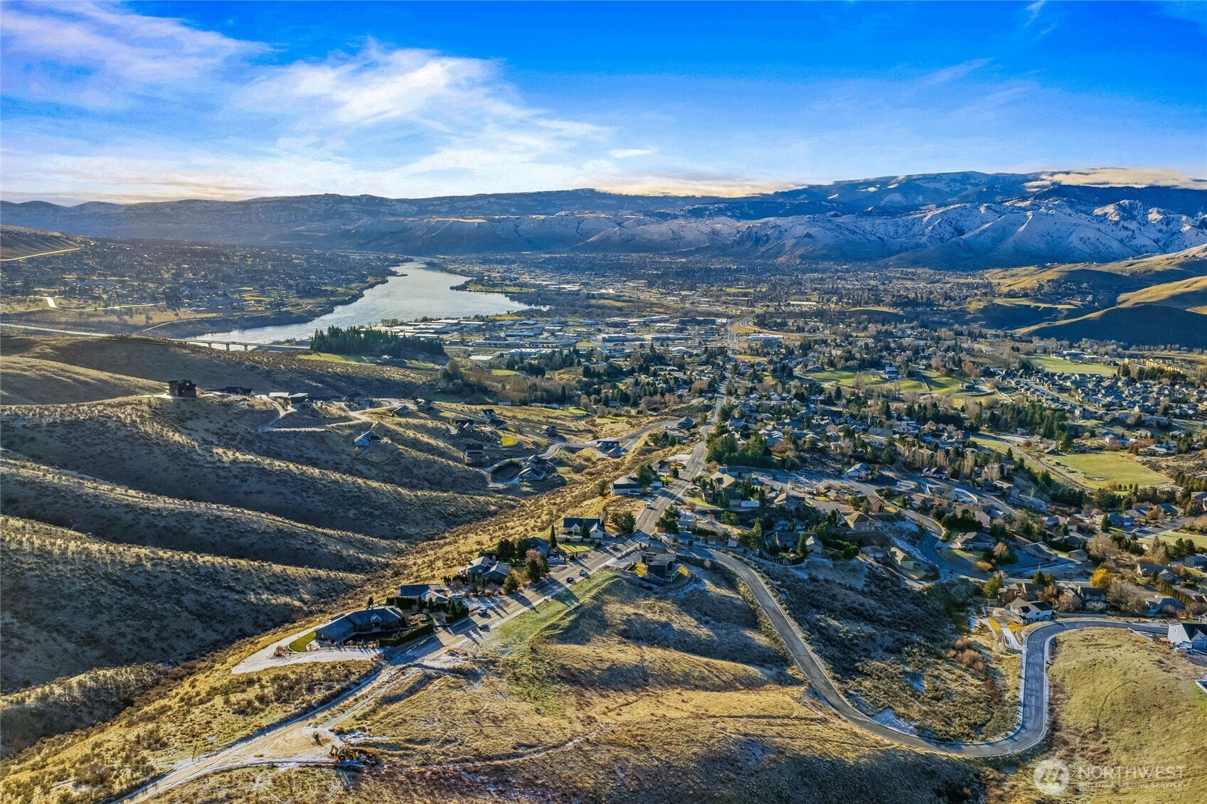 a view of a city with mountains in the background