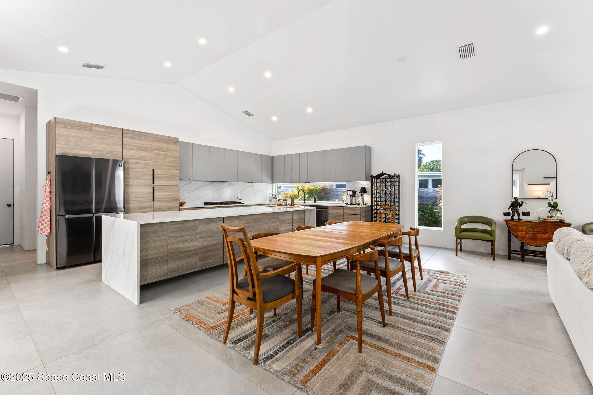 2619 Forest Drive Melbourne, FL 32901 - Photo 11 of 44 a large kitchen with a table and chairs