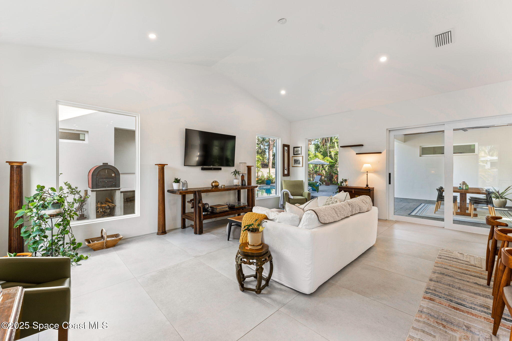 2619 Forest Drive Melbourne, FL 32901 - Photo 12 of 44 a living room with furniture and a flat screen tv