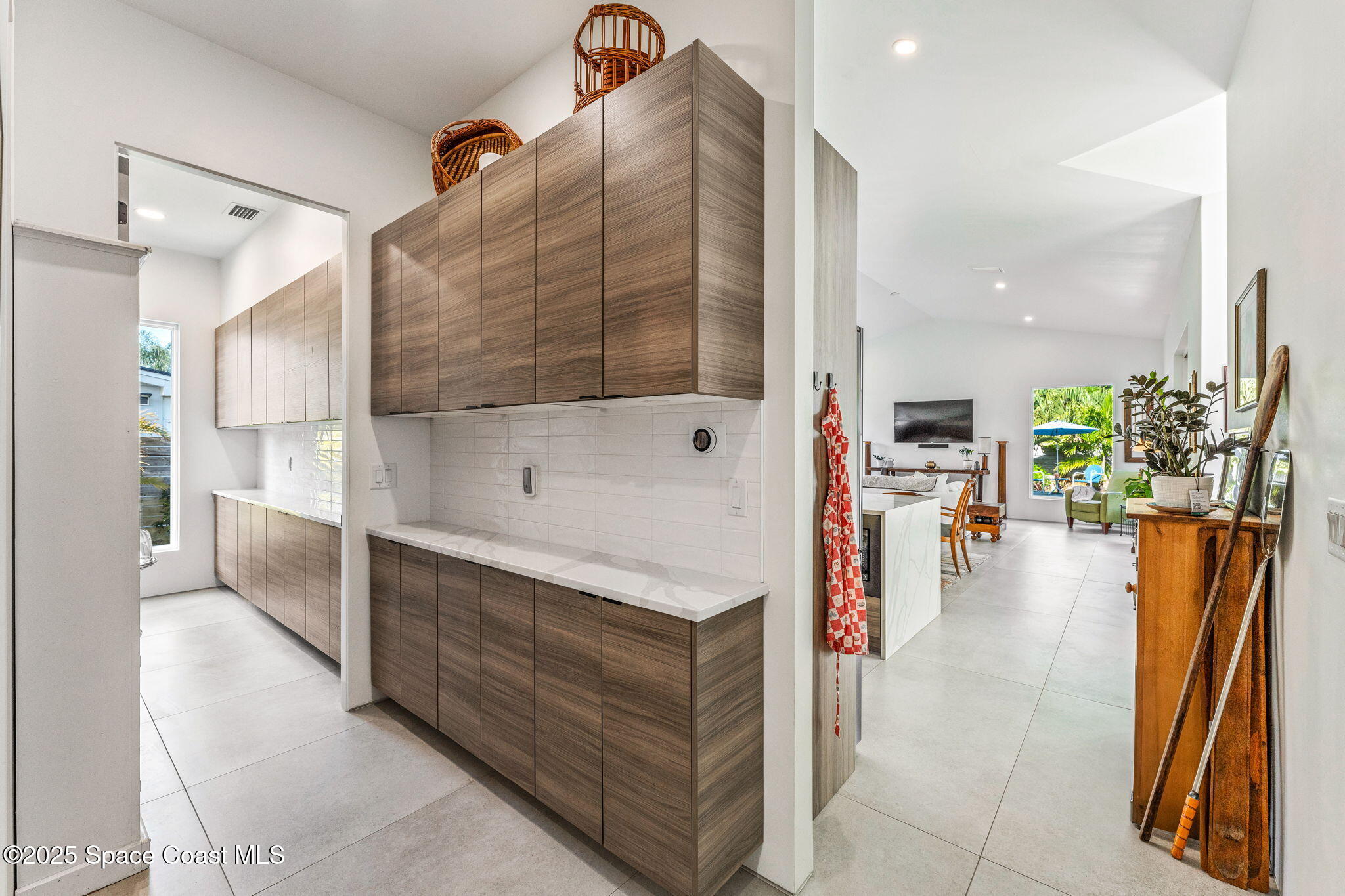 2619 Forest Drive Melbourne, FL 32901 - Photo 14 of 44 a kitchen with stainless steel appliances kitchen island granite countertop a refrigerator and a stove