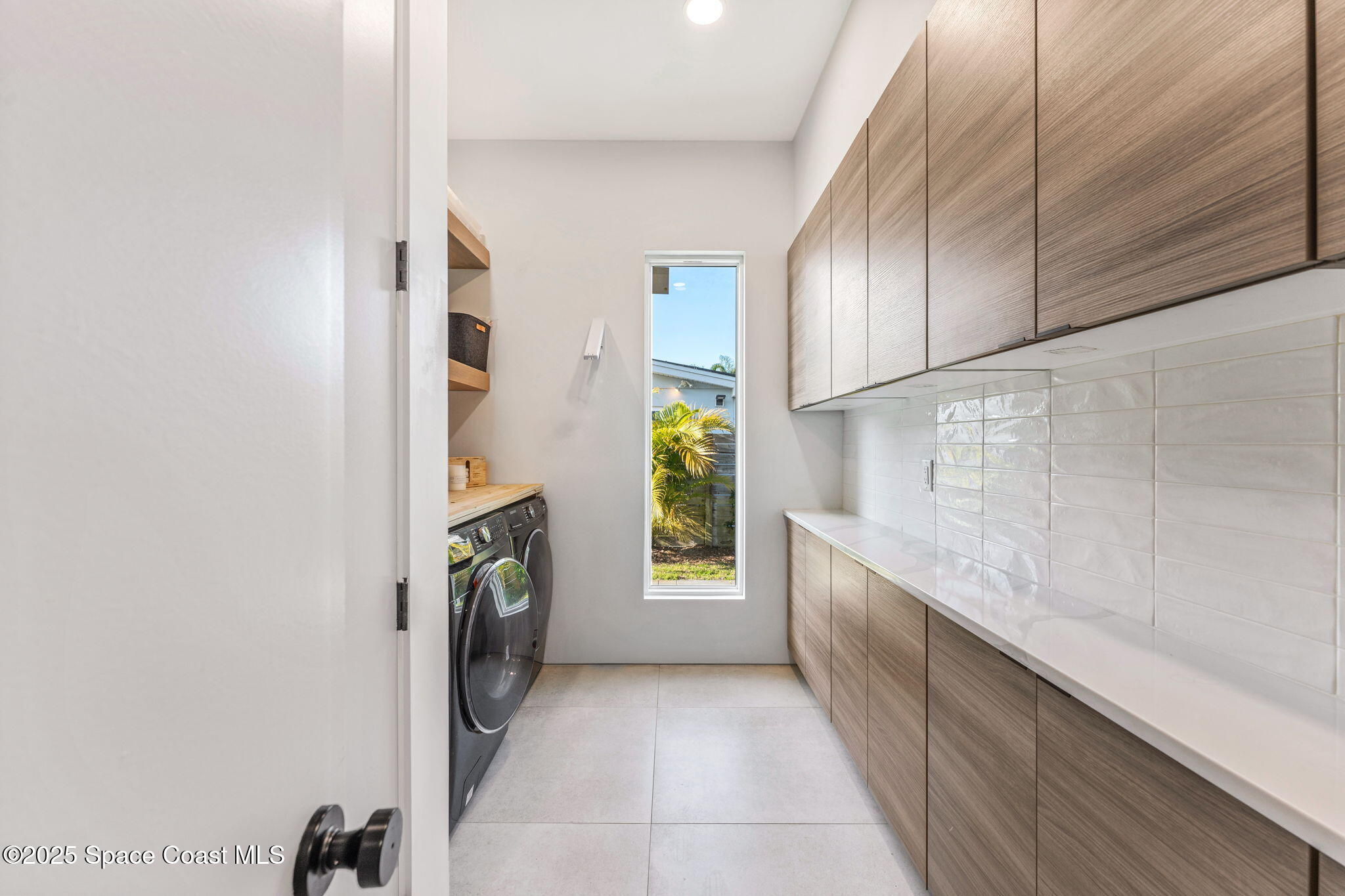 2619 Forest Drive Melbourne, FL 32901 - Photo 16 of 44 a hallway with washer and dryer