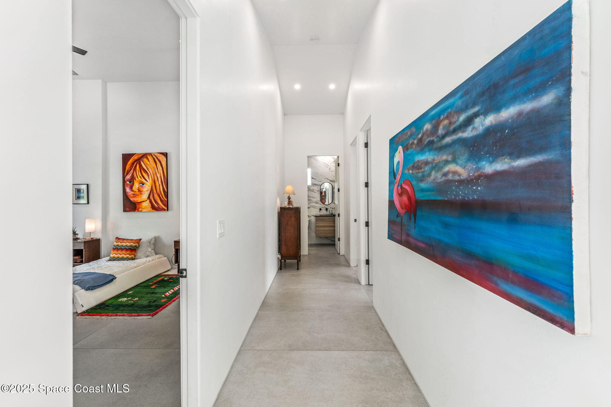 2619 Forest Drive Melbourne, FL 32901 - Photo 17 of 44 a hallway with painting on the wall and a painting on the wall