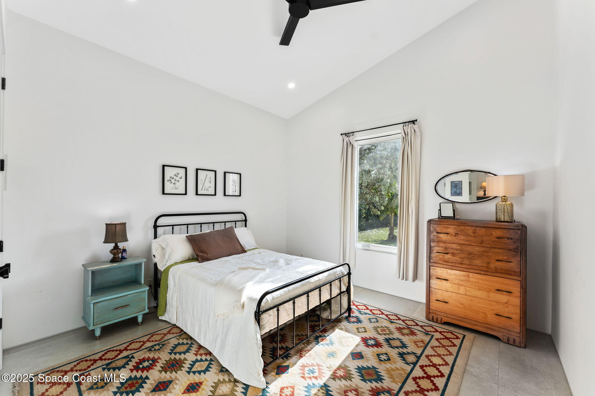 2619 Forest Drive Melbourne, FL 32901 - Photo 25 of 44 a bedroom with a bed and a dresser