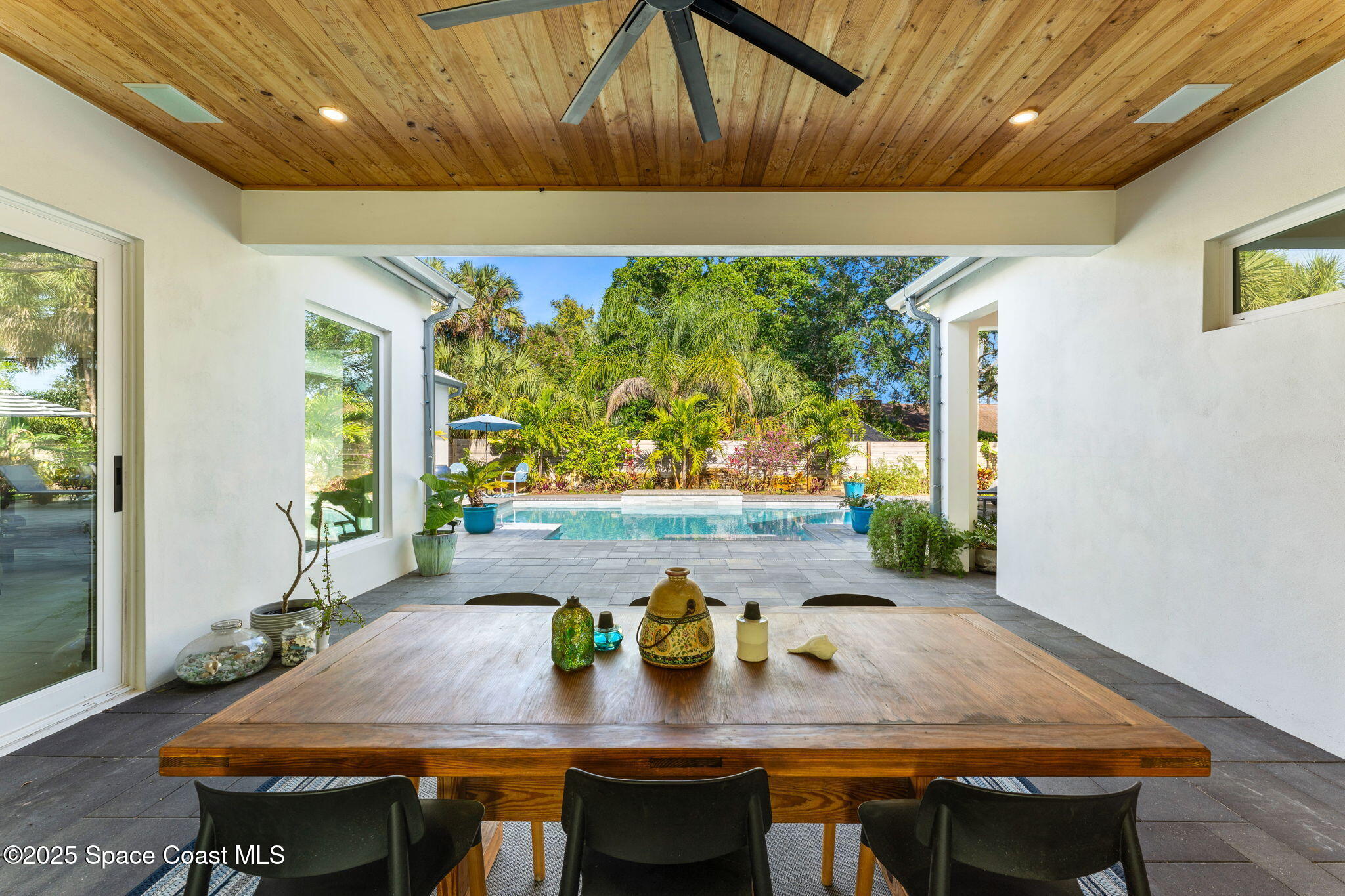 2619 Forest Drive Melbourne, FL 32901 - Photo 26 of 44 a view of a dining room with furniture window and wooden floor