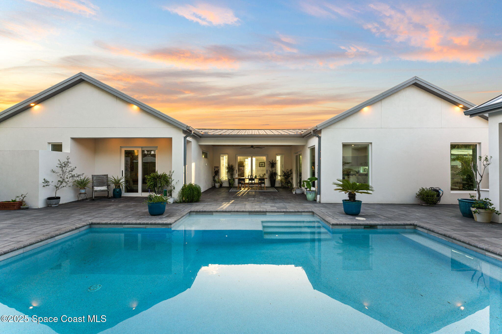 2619 Forest Drive Melbourne, FL 32901 - Photo 3 of 44 a view of a house with swimming pool and sitting area