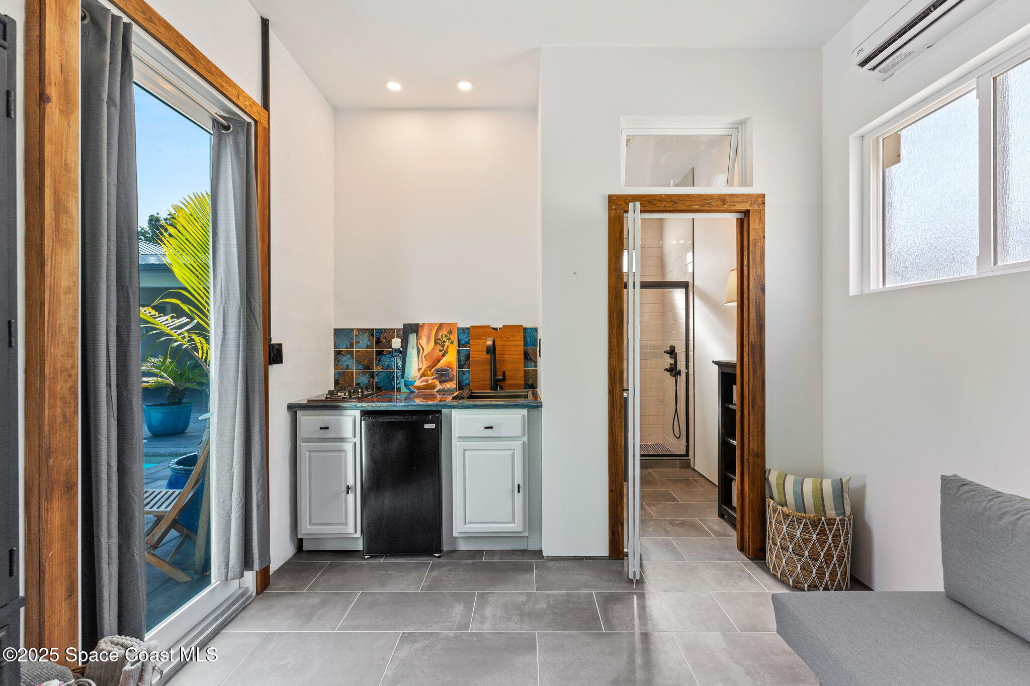 2619 Forest Drive Melbourne, FL 32901 - Photo 34 of 44 a living room with stainless steel appliances furniture and a window