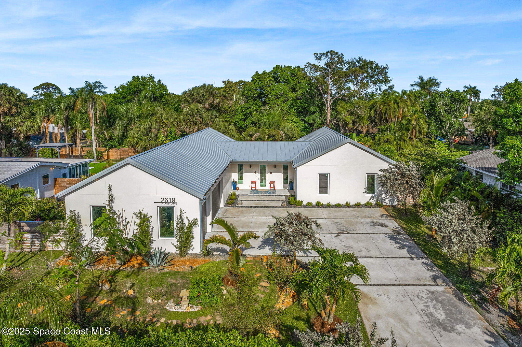 2619 Forest Drive Melbourne, FL 32901 - Photo 37 of 44 a house with trees in the background