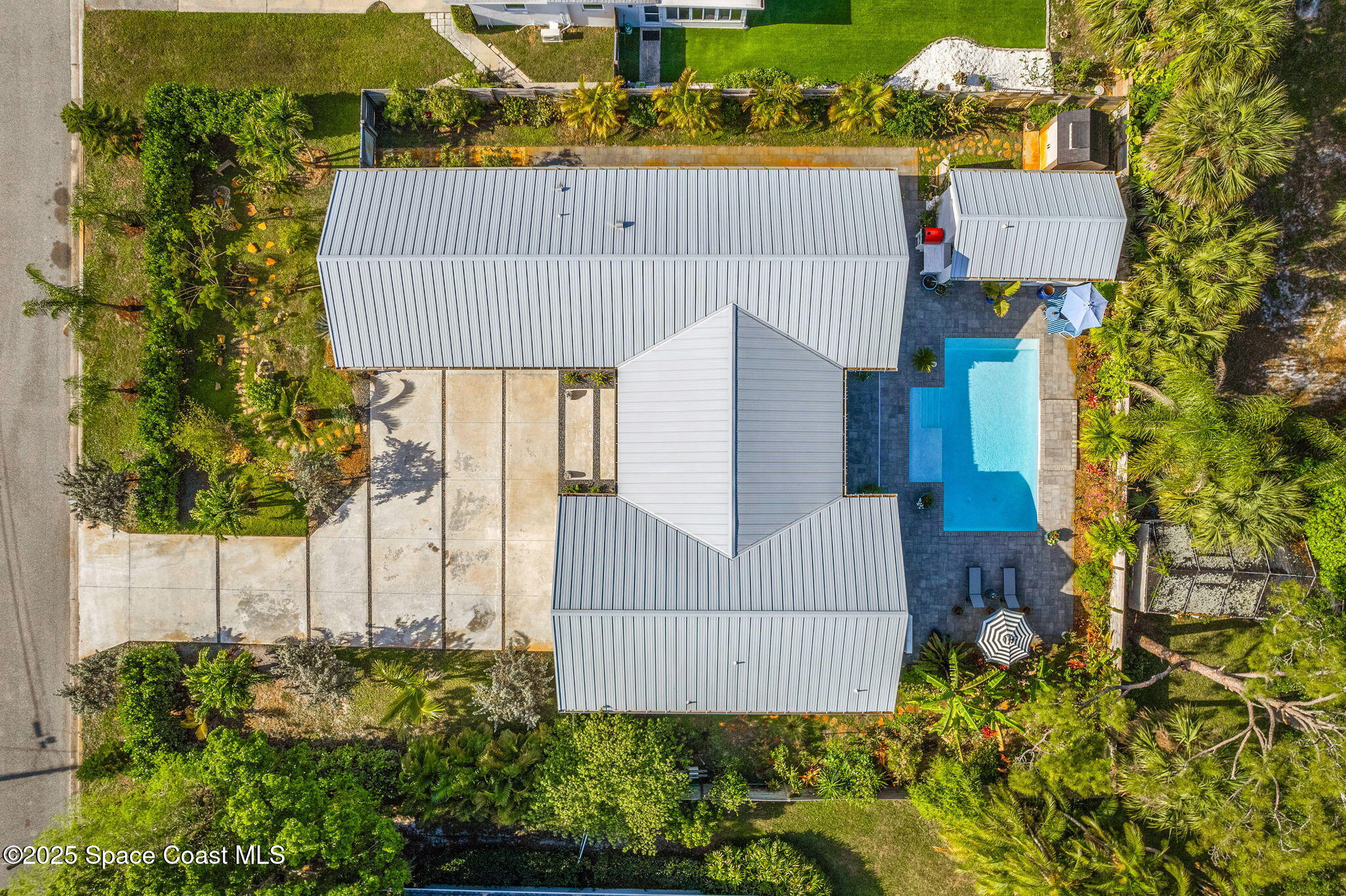 2619 Forest Drive Melbourne, FL 32901 - Photo 38 of 44 an aerial view of a house with a yard and a large tree