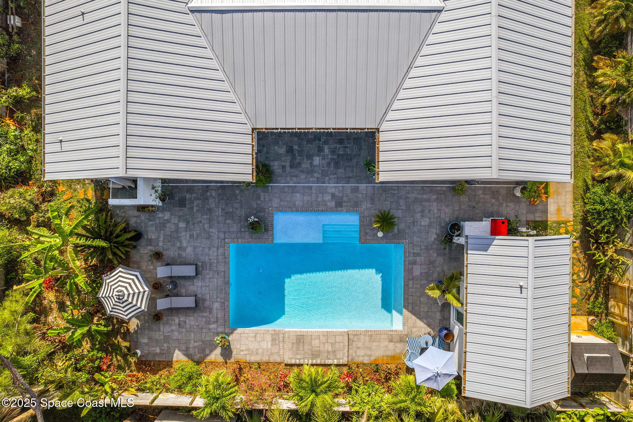 2619 Forest Drive Melbourne, FL 32901 - Photo 39 of 44 a view of a patio with chairs and potted plants