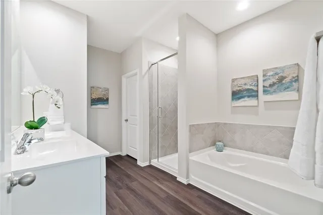 a bathroom with a bathtub and a shower