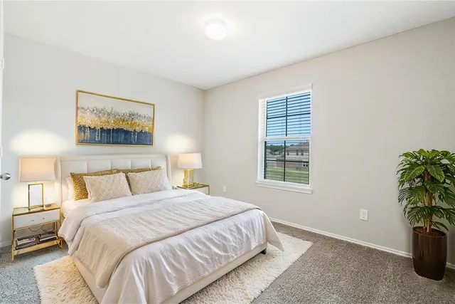 a view of a house with a backyard and a patio