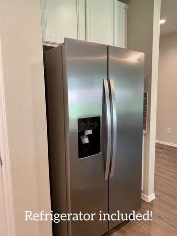 a view of a refrigerator in kitchen