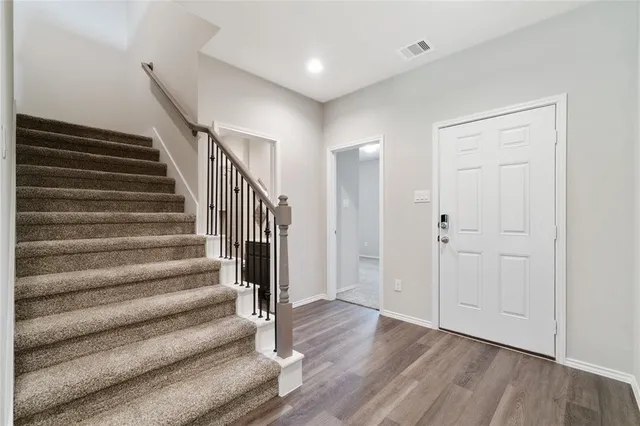 a view of entryway with wooden floor