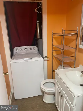 a bathroom with a sink and toilet