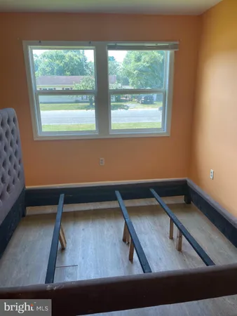 a view of a living room with furniture and a window