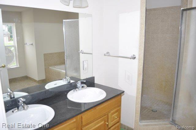 5897 High Point Court, Unit 9 Brighton, MI 48116 - Photo 16 of 22 Master Bath