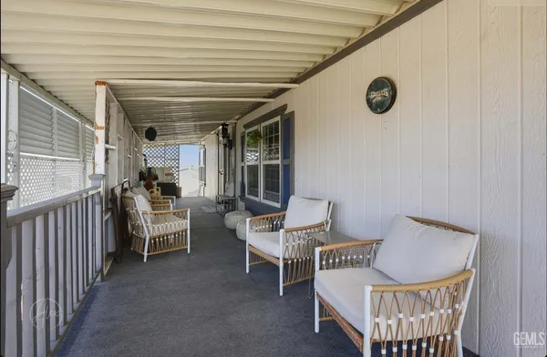 a view of an house with backyard and porch