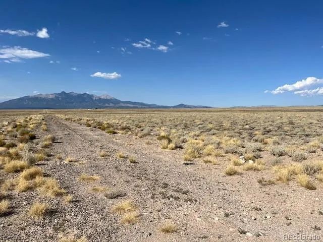 a view of an ocean beach and mountain